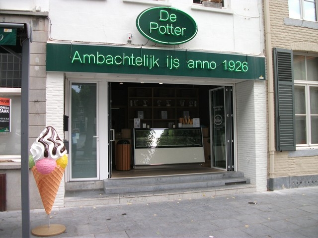Black aluminum bifold glass doors fully opened connecting indoor living space to outdoor patio area